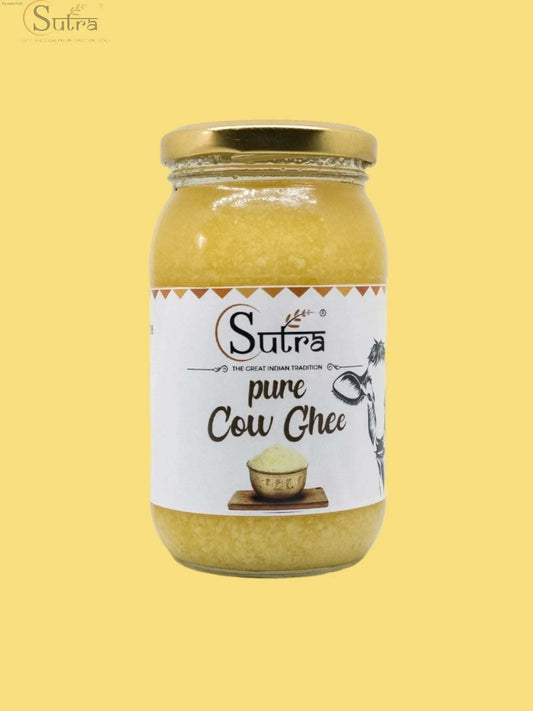 A2 cow ghee in a traditional jar with a spoon, showcasing its golden, rich texture. A comparison with regular ghee, emphasizing the purity and nutritional benefits of A2 cow ghee.