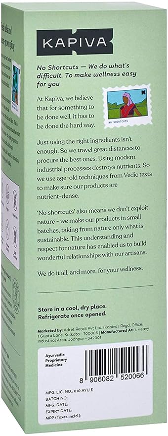 A glass of herbal juice being poured