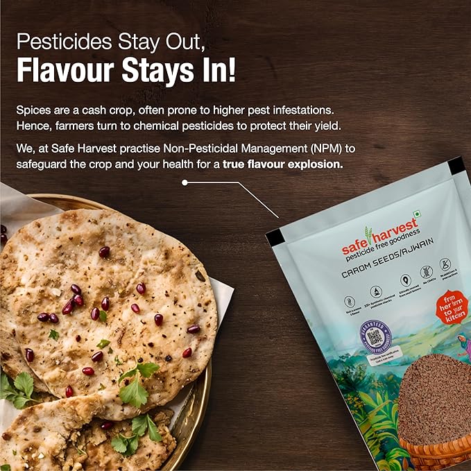 Ajwain seeds sprinkled on a wooden spoon over rustic background