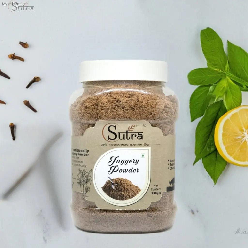 Delicious Natural Jaggery Powder jar with natural sweetener label, surrounded by herbs and