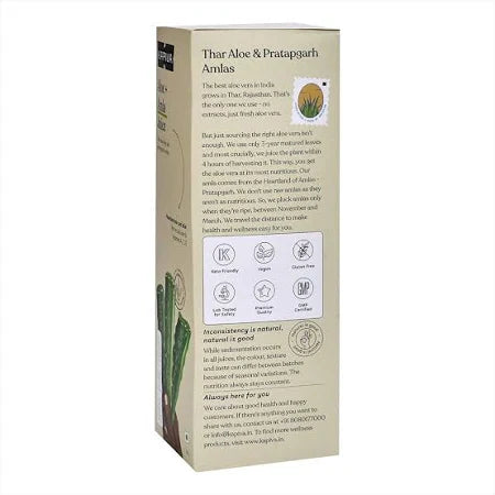 Glass of juice with ingredients beside it