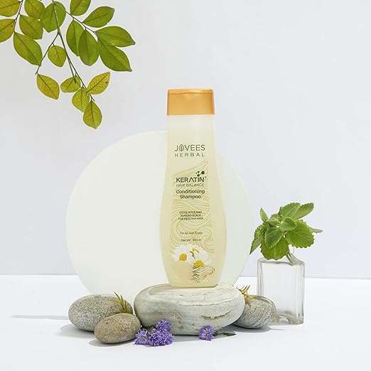 Jovees Shampoos bottle with natural herbal ingredients for hair care.