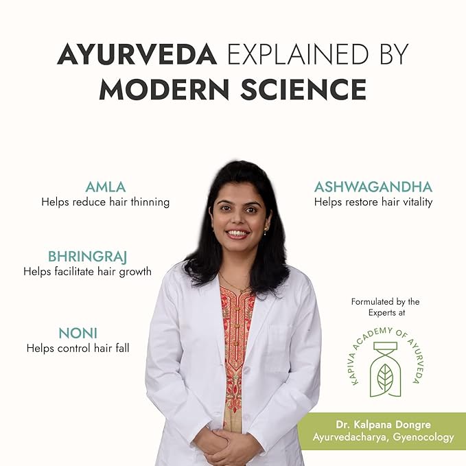 Woman combing long, healthy hair with juice on side