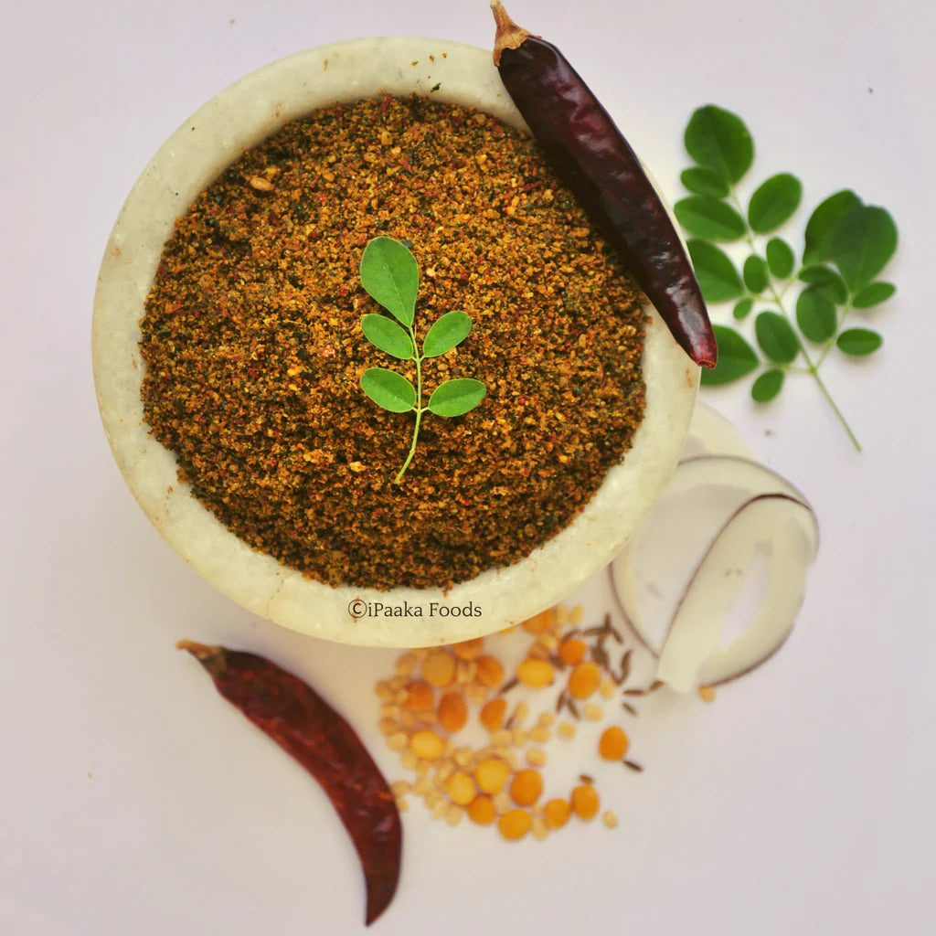 Green moringa chutney powder in wooden bowl