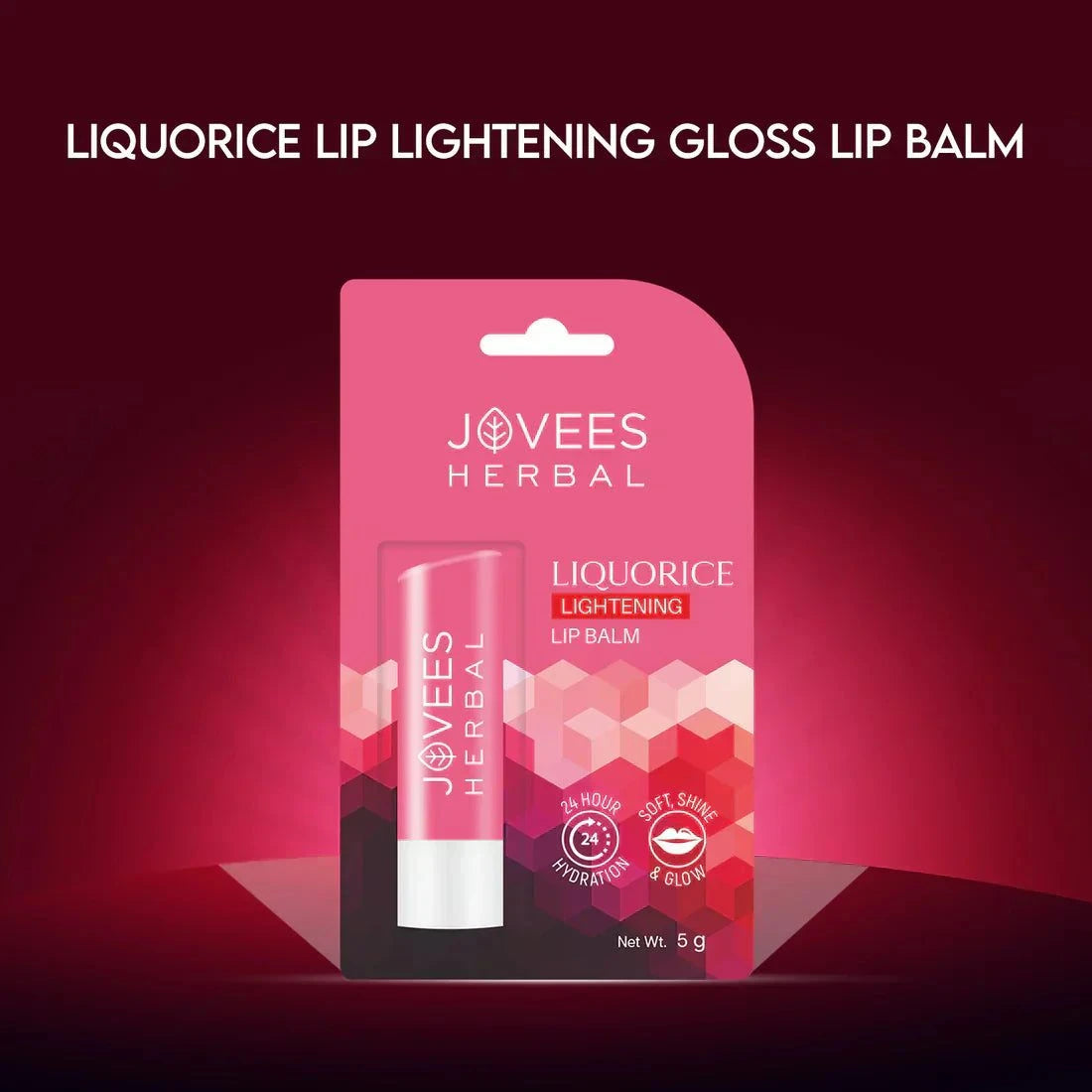 Jovees Herbal Liquorice Lip Balm packaging against a pink background.