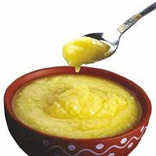 Organic Pure Desi Cow Ghee on Wooden Spoon
